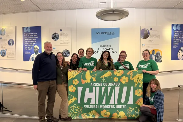 Workers from BPLD in the library holding a Cultural Workers Union banner